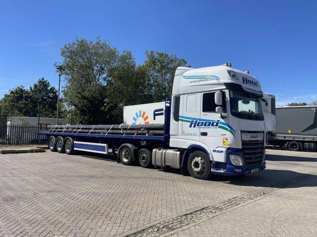 tj-hood-lorry-flatbed.jpg A TJ Hood lorry with a flatbed trailer attached, making a delivery